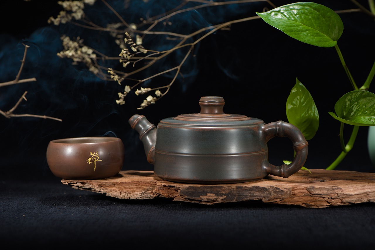 a tea pot sitting on top of a wooden table next to a cup, by An Zhengwen, product photo, 8 к, pot, product photograph
