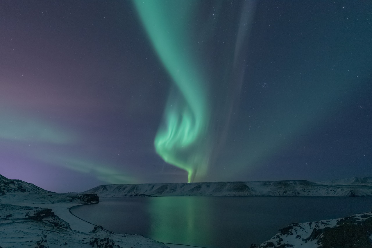 a green and purple aurora bore over a body of water, a picture, by Jóhannes Geir Jónsson, pexels contest winner, hurufiyya, beautiful lighting uhd, snowy, balaskas, 4 k )