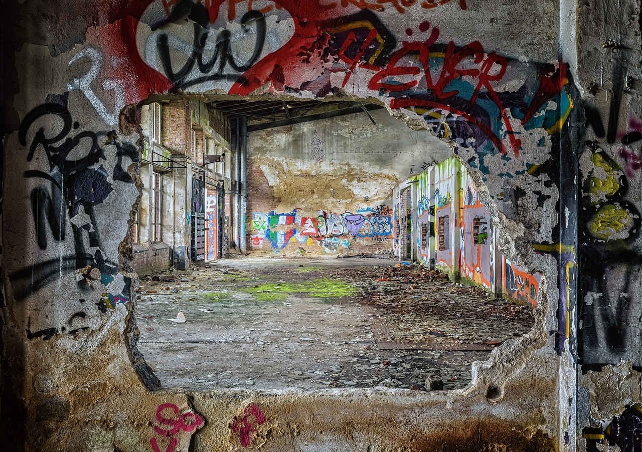 the inside of an abandoned building with graffiti all over it, flickr, graffiti, world seen only through a portal, colorful composition, a ghetto in germany, looking across the shoulder