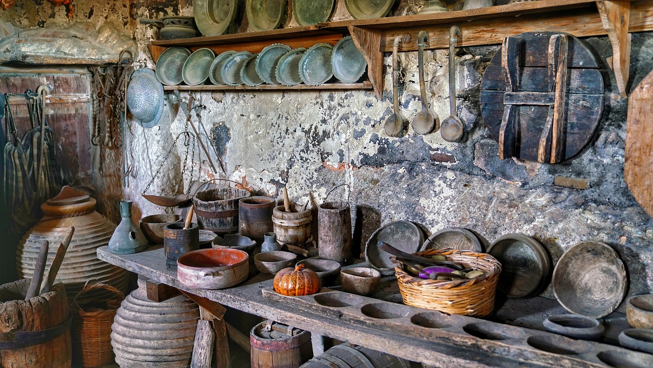 a room filled with lots of pots and pans, inspired by Jacob Maris, flickr, folk art, photo taken in 2018, inner ward of a medieval castle, polish mansion kitchen, orkney islands