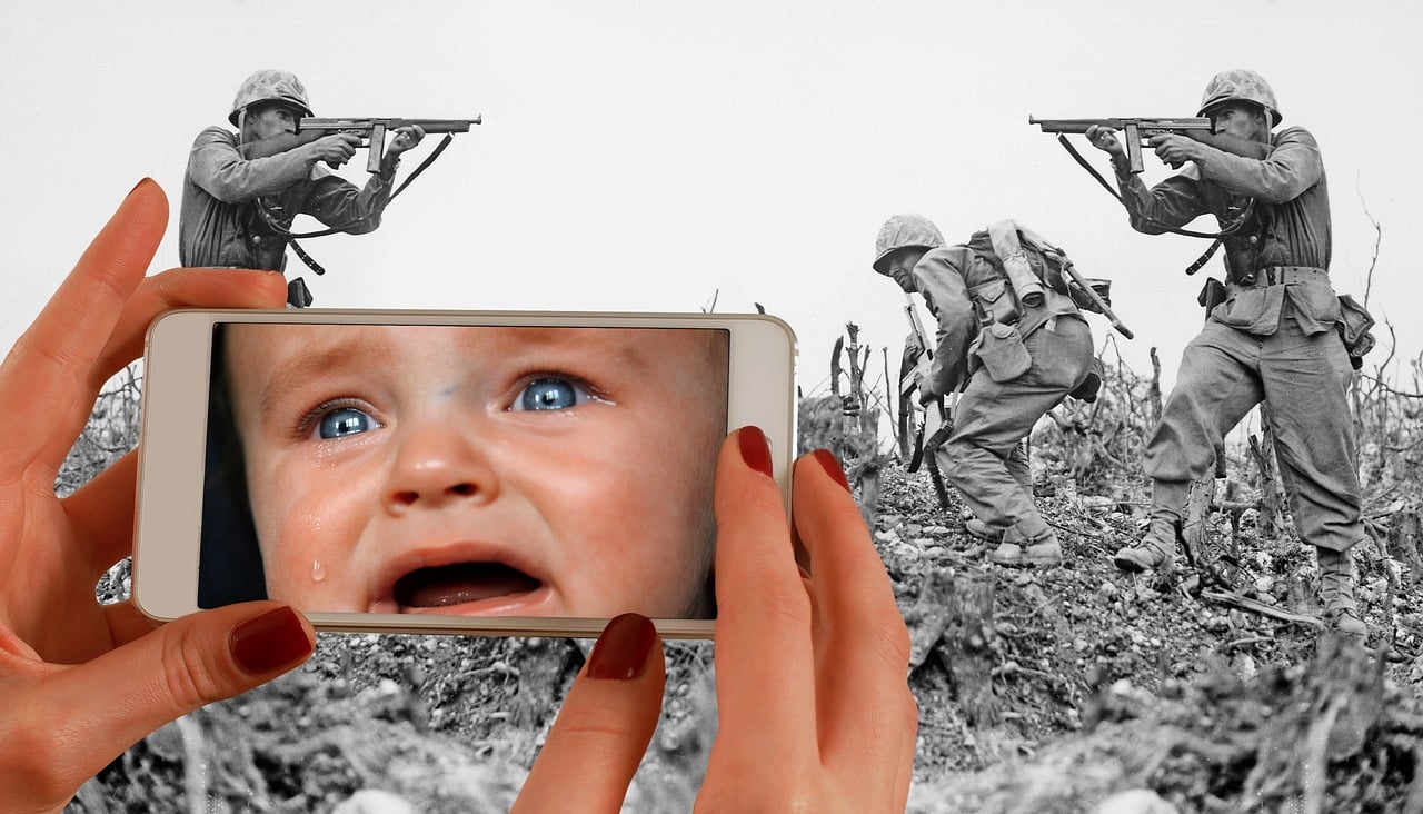 a close up of a person holding a cell phone, a colorized photo, by Mirko Rački, digital art, war in background, maternal photography 4 k, memes, helpless