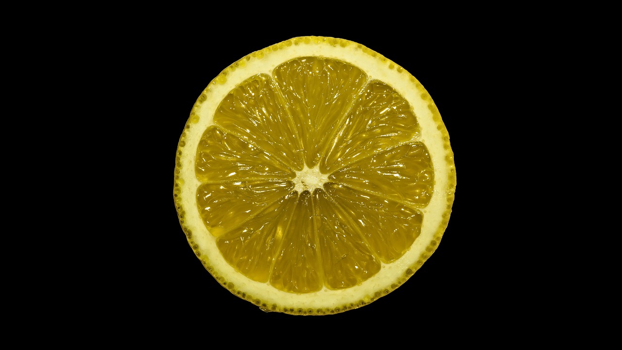 a half of a lemon on a black background, by Adam Chmielowski, minimalism, very very very ultradetailed, -h 1024, new mexico, f/11