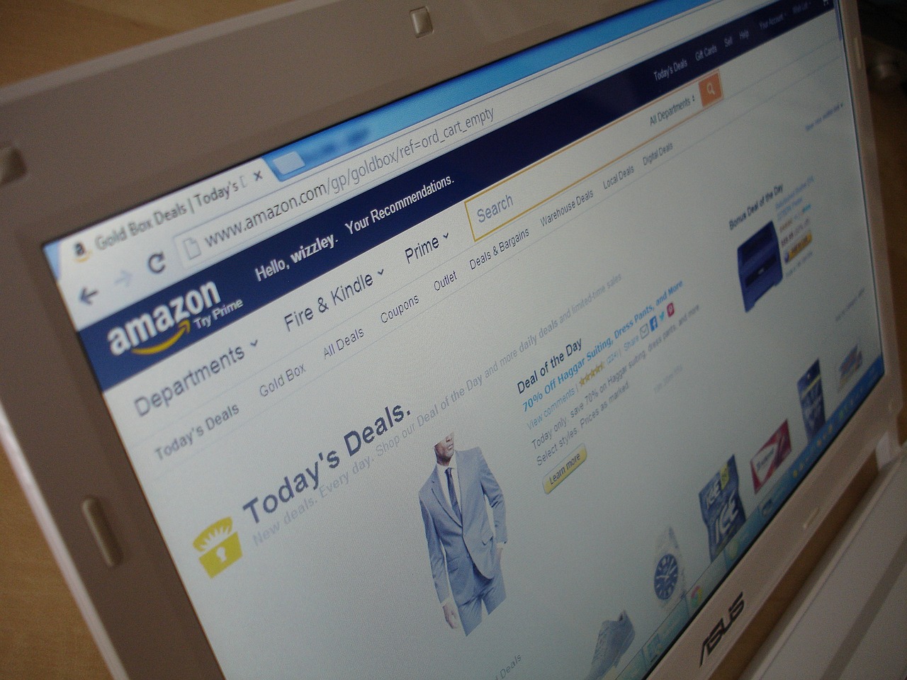 a laptop computer sitting on top of a wooden desk, a photo, by Daniel Taylor, amazon warrior, ebay website, a bald, today's featured photograph