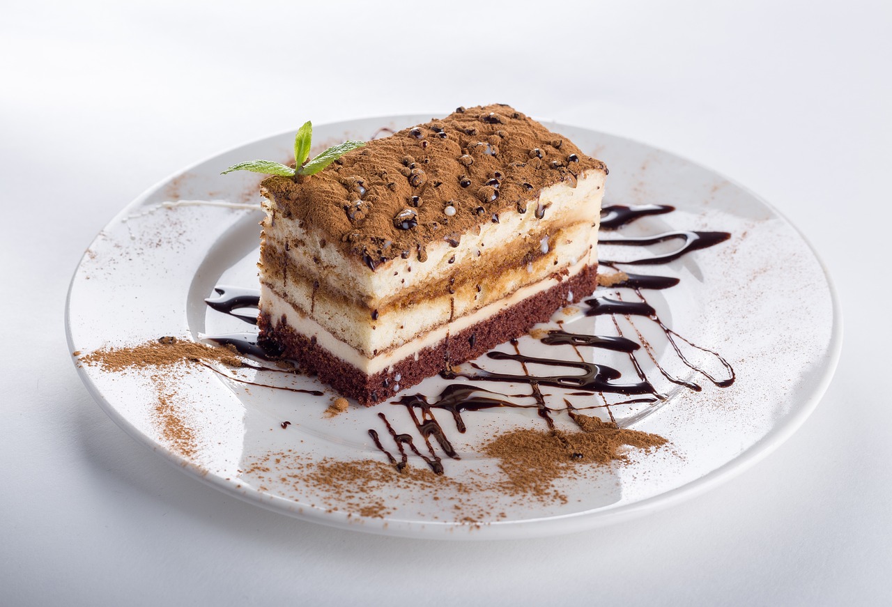 a piece of cake sitting on top of a white plate, inspired by Antonín Chittussi, trending on pixabay, renaissance, brown colours, restaurant menu photo, rectangular, multi - layer