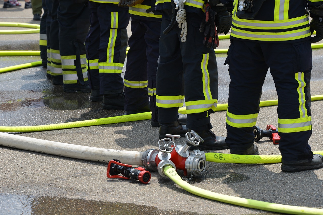 a group of firefighters standing next to a fire hose, a photo, by Christen Dalsgaard, shutterstock, basic photo, valves, corps scattered on the ground, high detailed photo