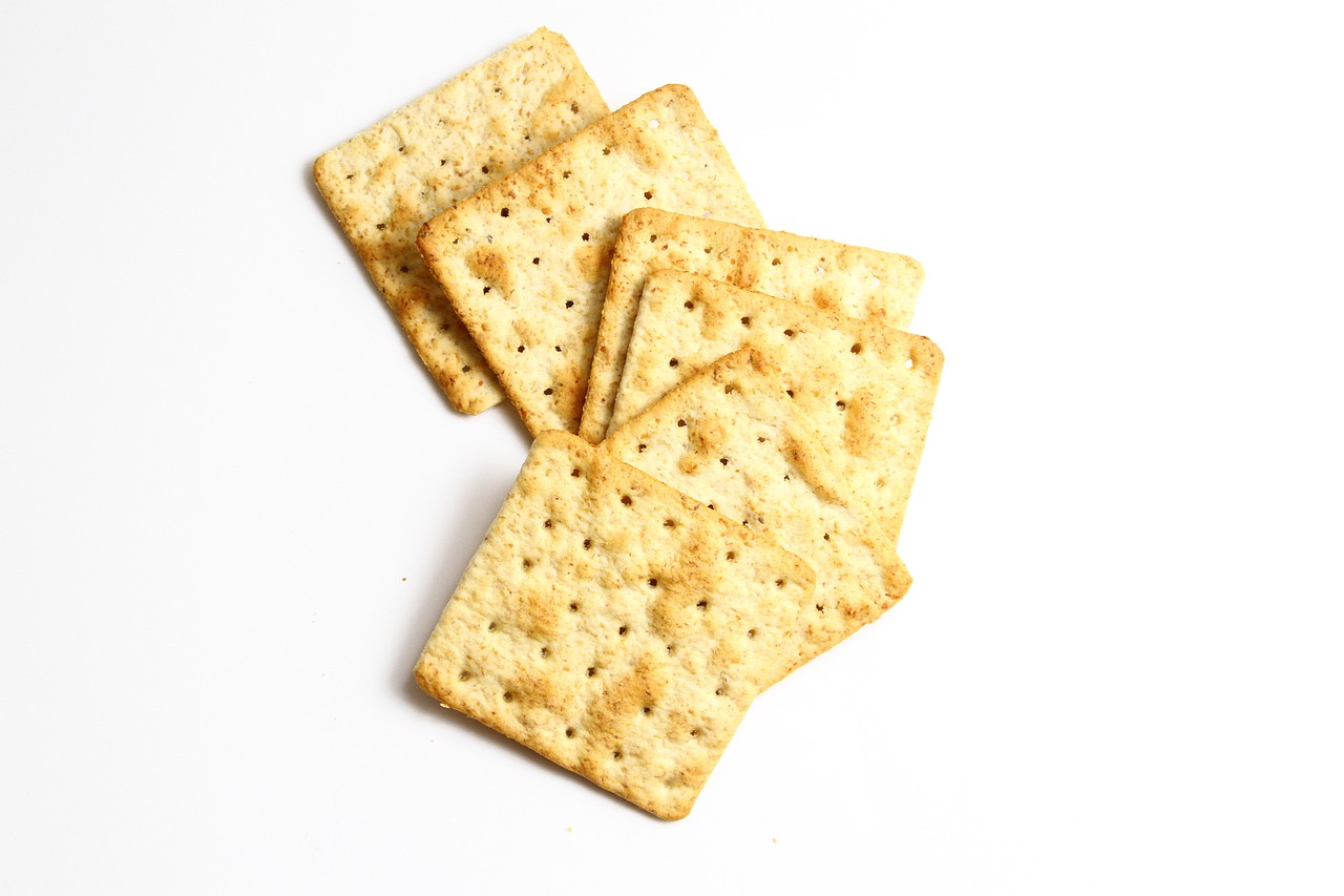 a pile of crackers sitting on top of a white table, a picture, by Alexander Robertson, istockphoto, squares, 6 pack, biroremediation