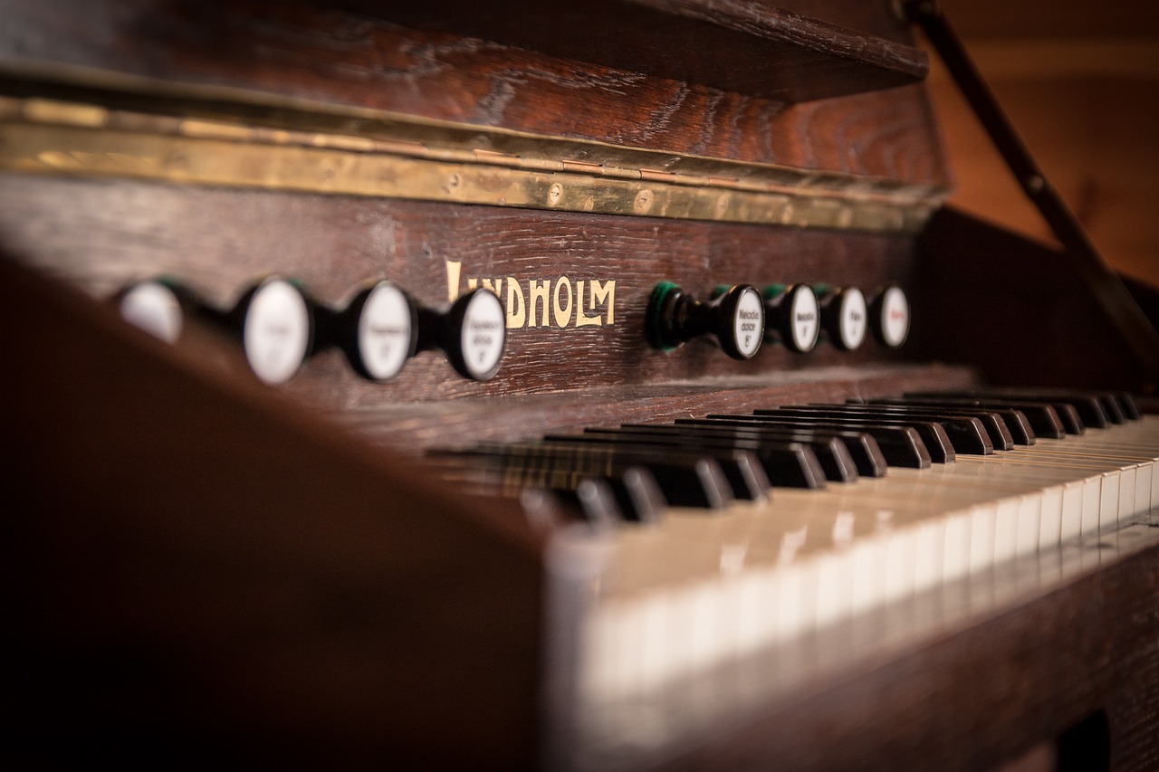 a close up of the keys of a piano, inspired by Pál Böhm, sholim, jukebox, wooden, beautiful surroundings