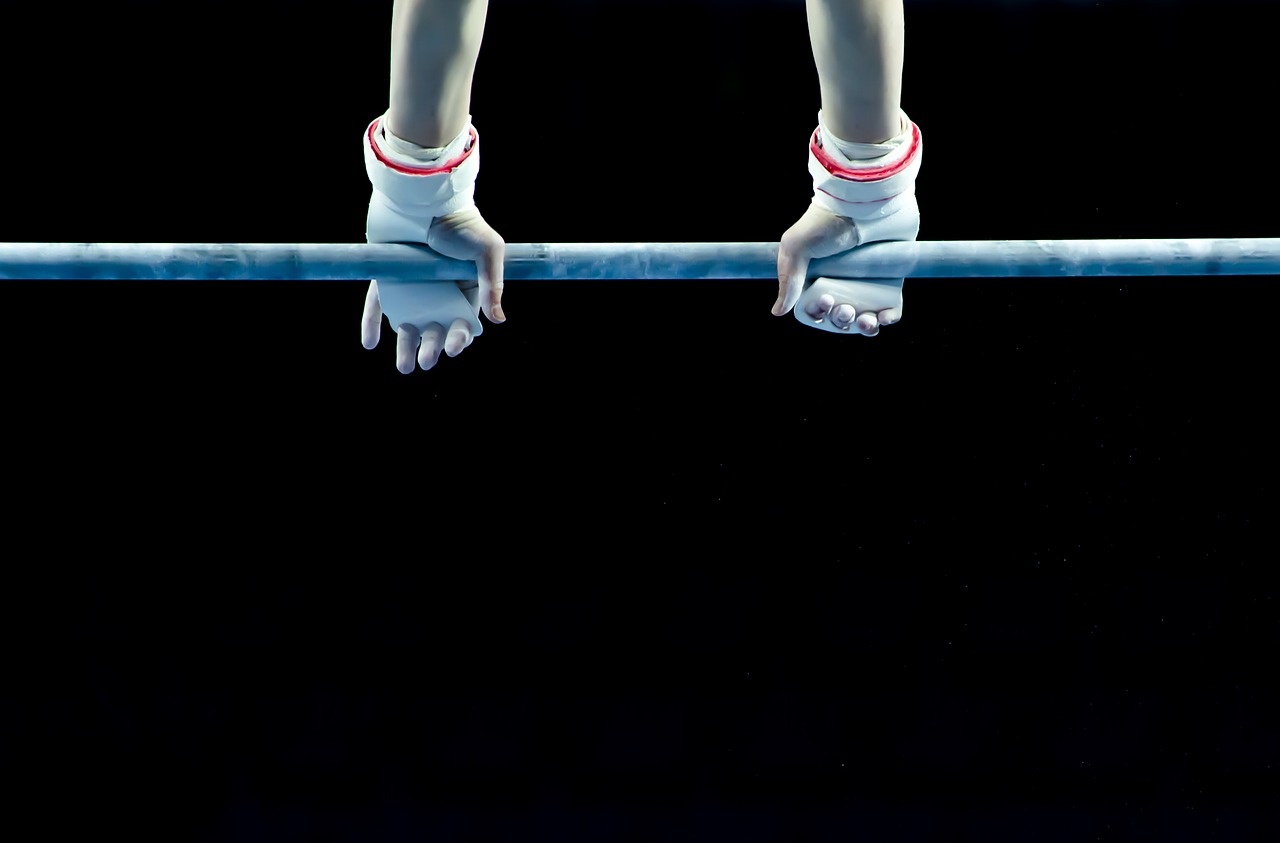 a close up of a person on a balance beam, by Alexis Grimou, shutterstock, realism, twintails white_gloves, nighttime, top down photo, stock photo