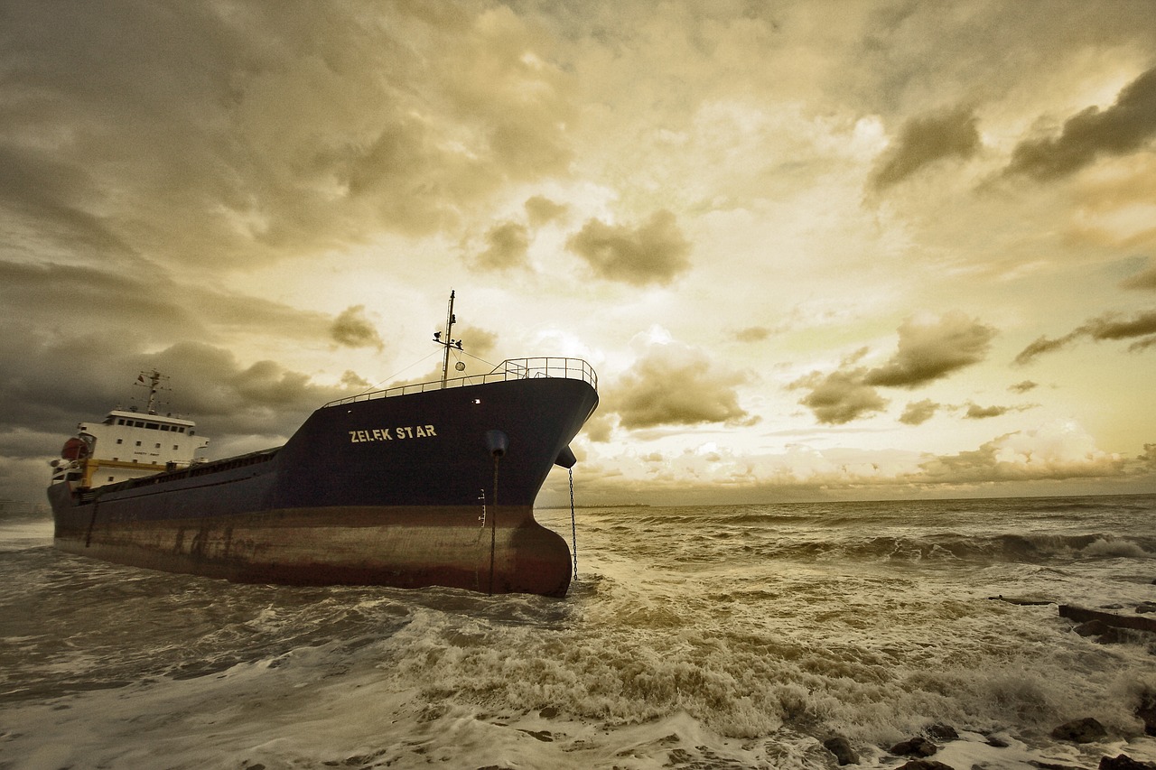 a large boat sitting on top of a body of water, a portrait, inspired by Michal Karcz, flickr, utilitarian cargo ship, trent parke, realistic”, redscale photography