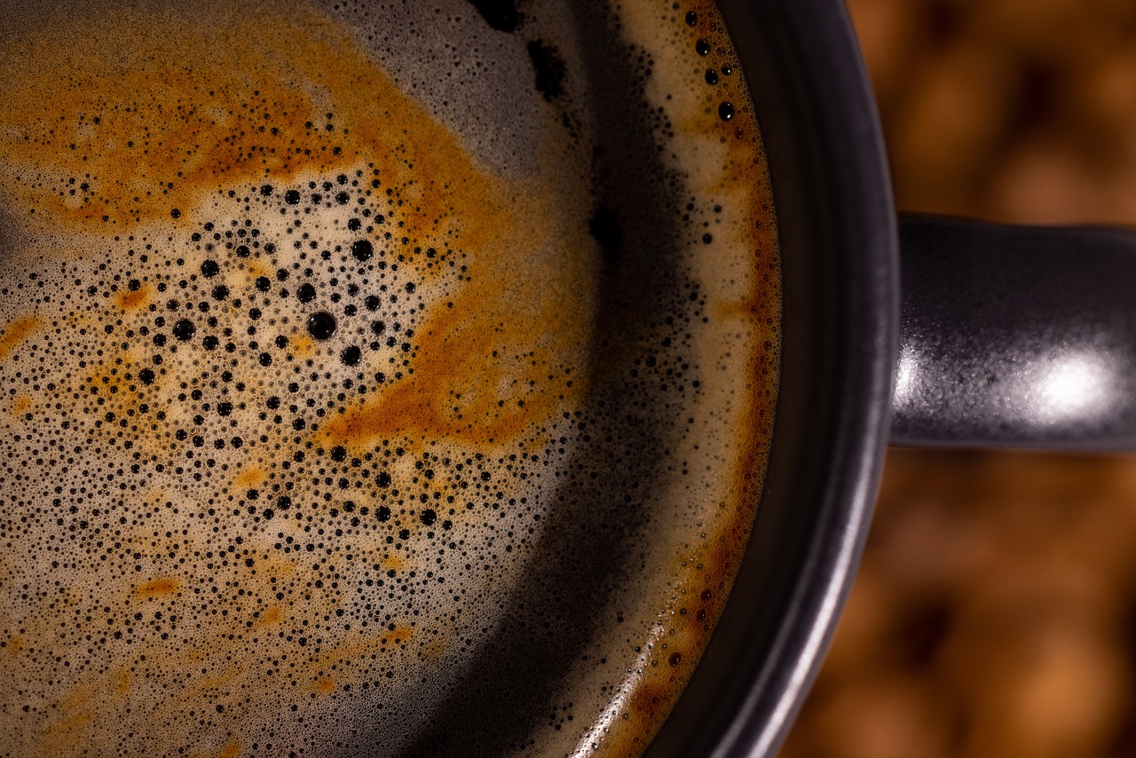 a close up of a cup of coffee, a macro photograph, boiling, top down photo, 8 k detail post - processing, some rust