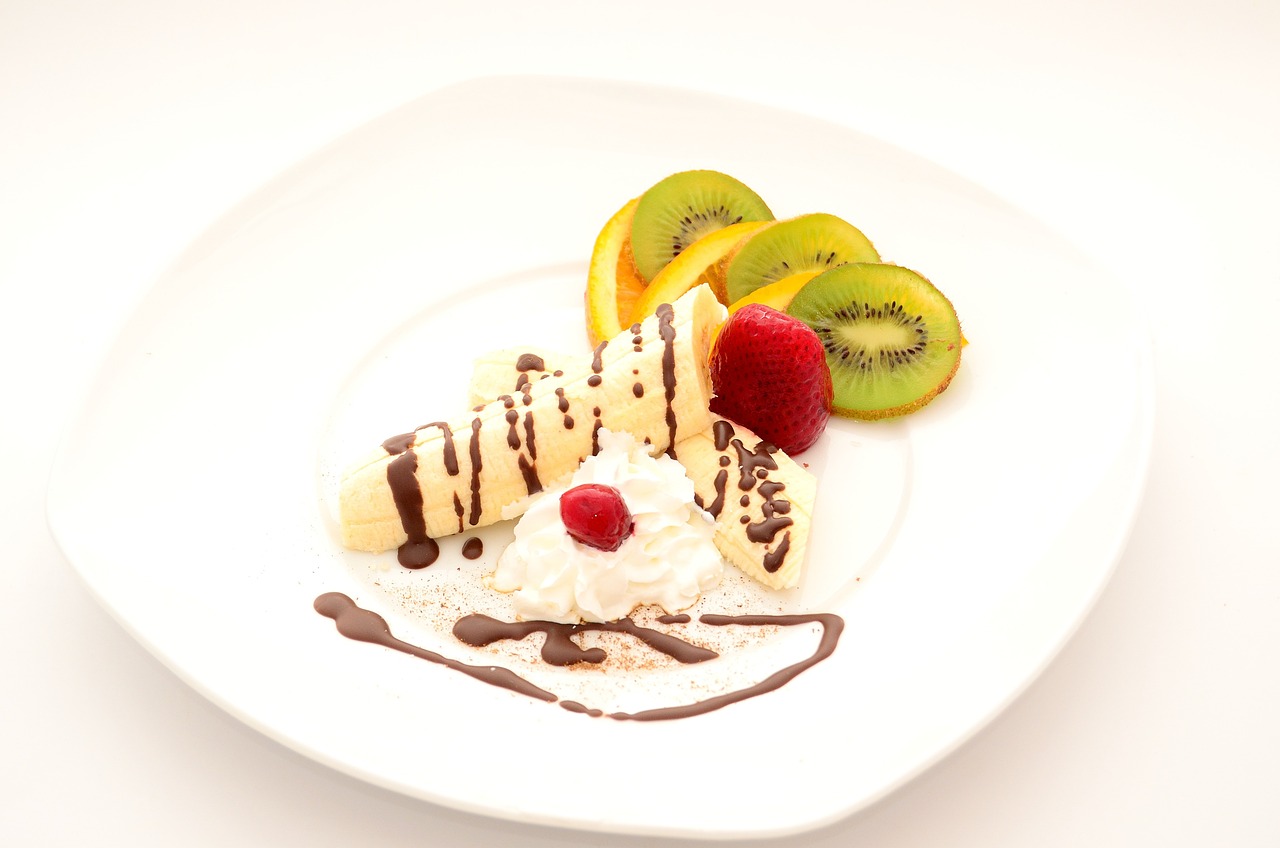 a white plate topped with fruit and ice cream, romanticism, product photo, product introduction photo, some chocolate sauce, restaurant menu photo