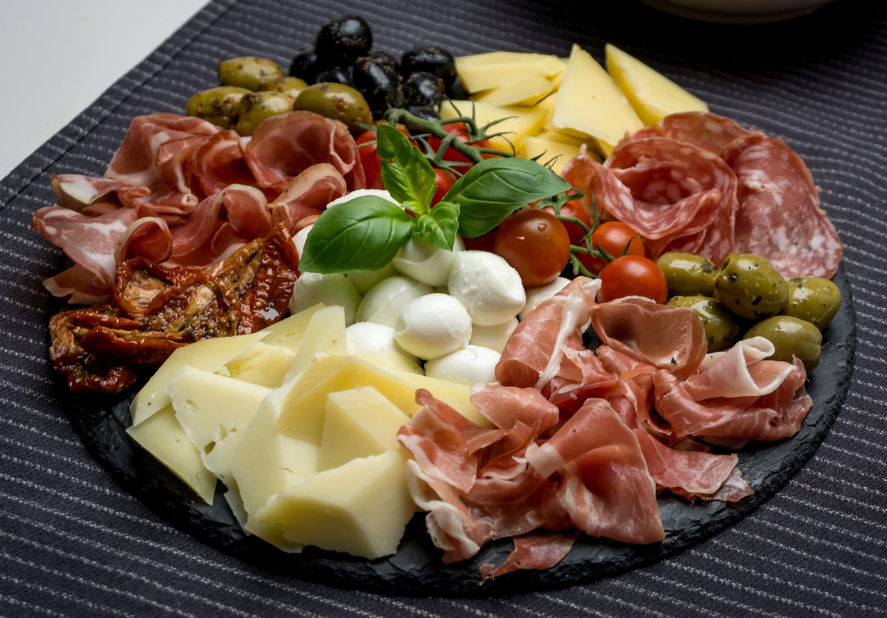 a close up of a plate of food on a table, by Carlo Maderna, shutterstock, dau-al-set, high quality product image”, cheeses, high detail product photo, black