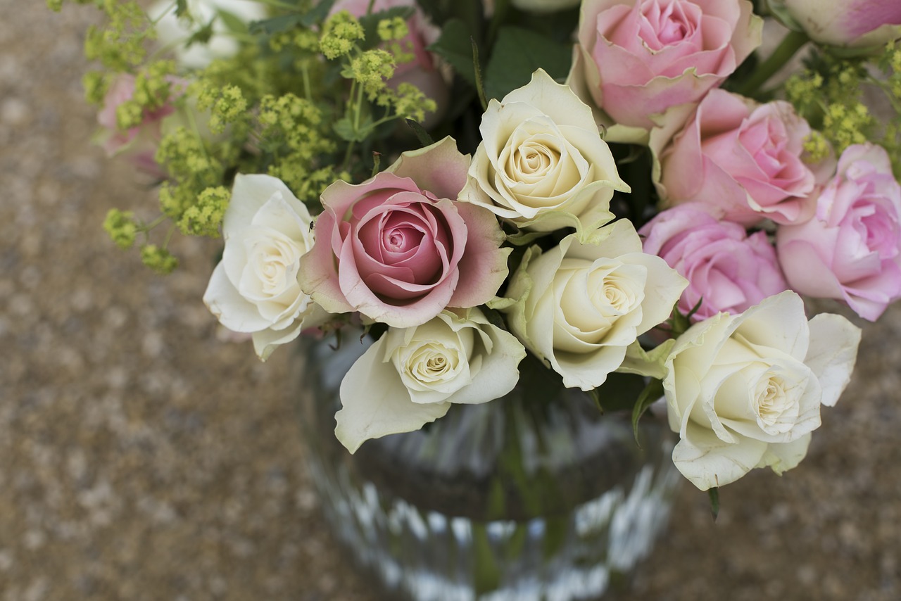 a vase filled with pink and white roses, a picture, pexels, clear focused details, close-up from above, aged 2 5, entertaining