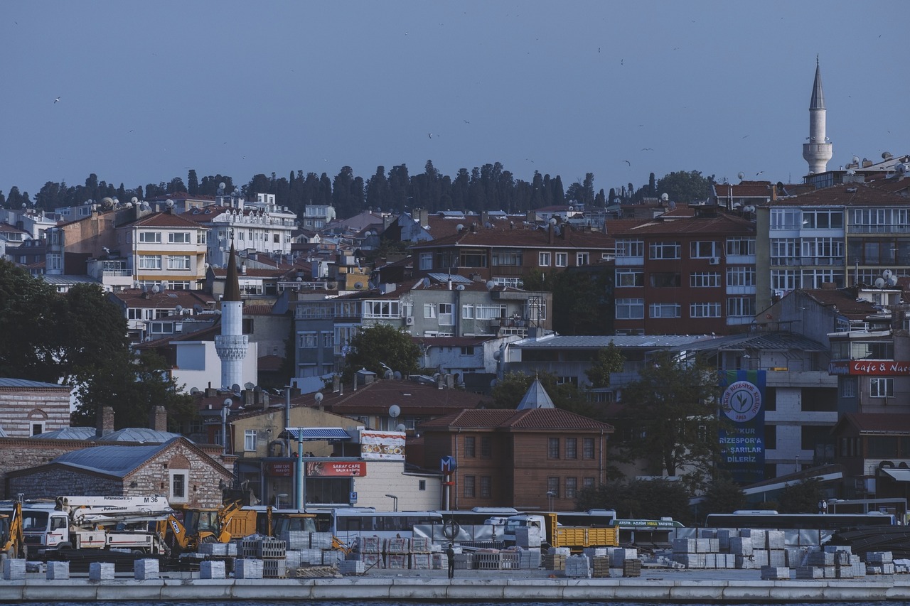a large body of water with lots of buildings in the background, a picture, by Yasar Vurdem, hurufiyya, hiding in the rooftops, view from the streets, fine detail post processing, early evening
