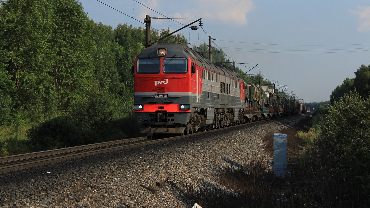 a large long train on a steel track, by Petr Brandl, flickr, dau-al-set, locomotive, denis sarazhin, summer evening, trio