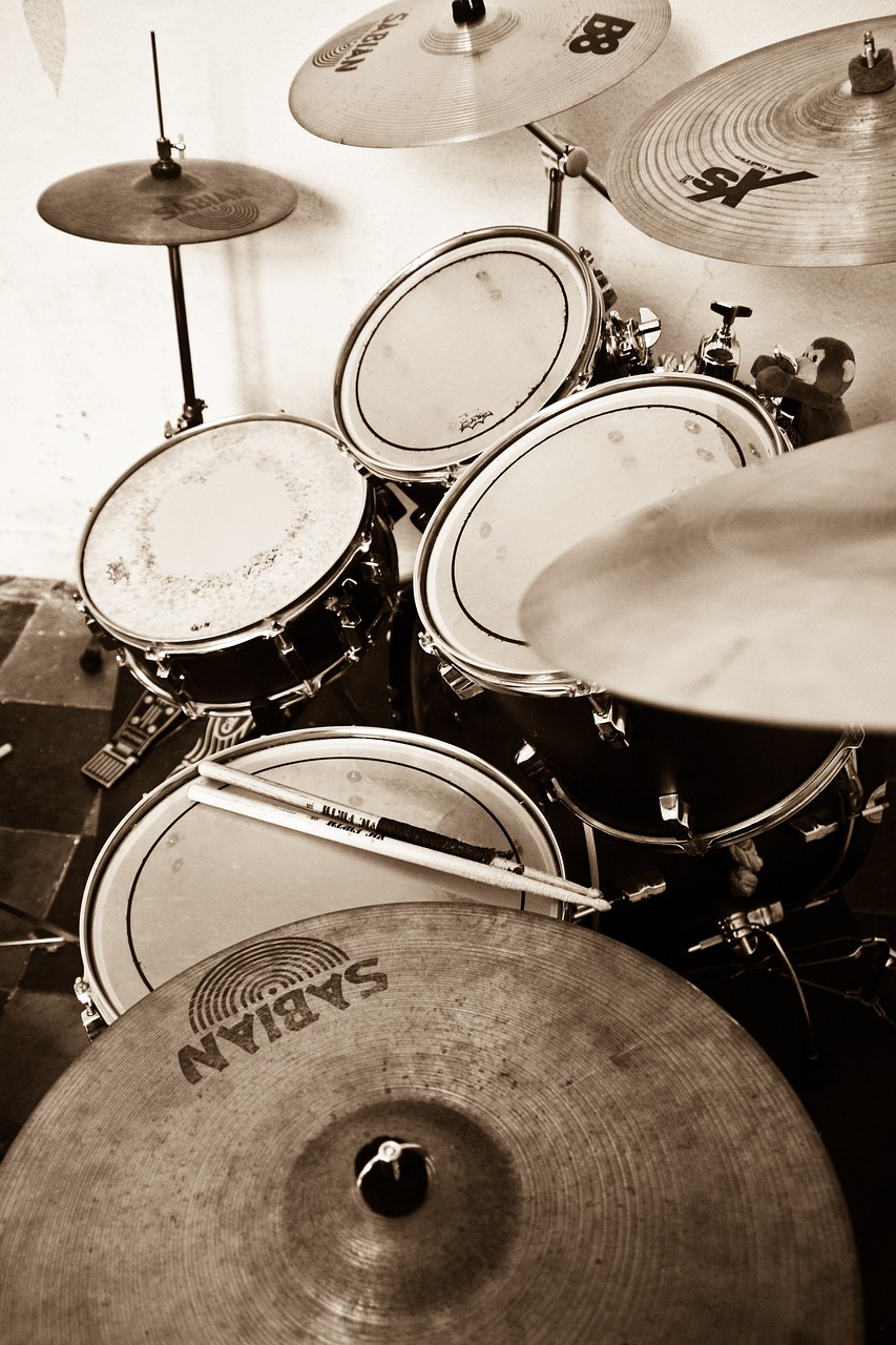 a black and white photo of a drum set, by Matt Stewart, flickr, dau-al-set, sepia, eye - level view, wip, phone photo