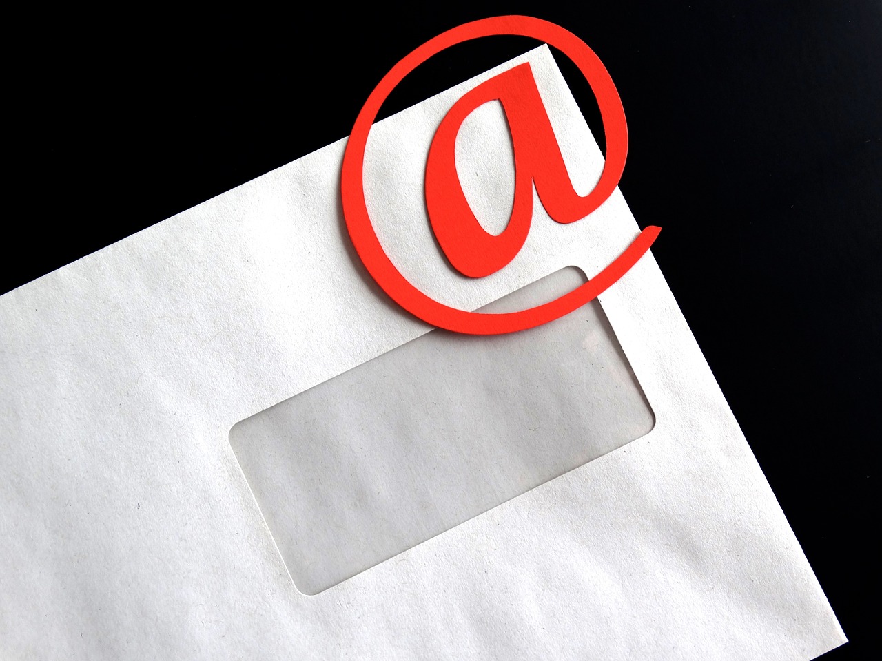 a close up of a mail envelope with a red at sign, by Allen Jones, use of negative space allowed, social media, composite, case