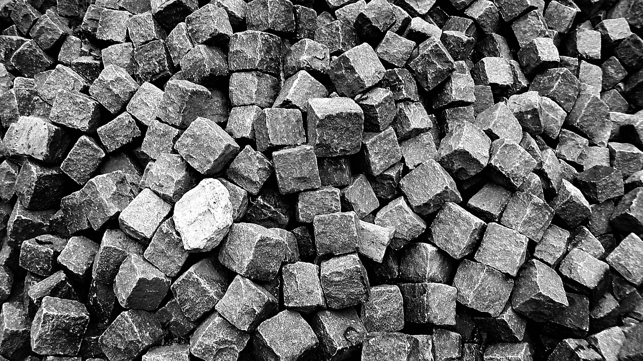a black and white photo of a pile of rocks, by Konrad Krzyżanowski, pixabay, squares, forge, iron, istock
