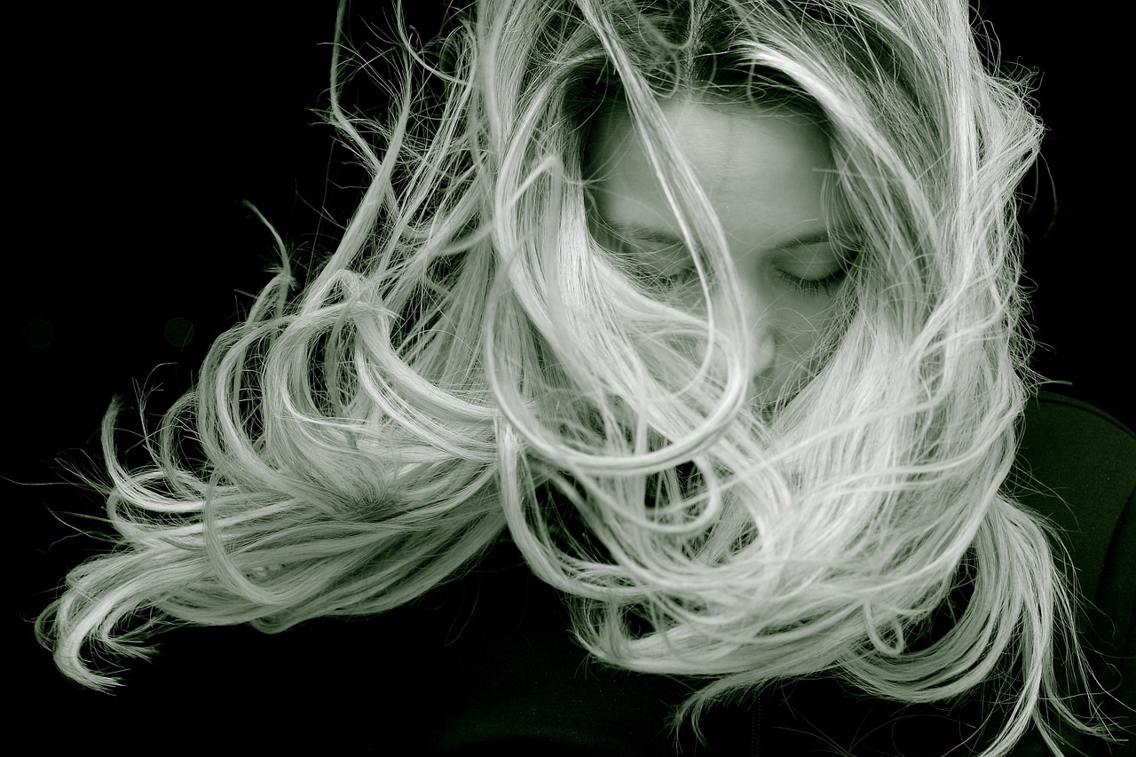 a black and white photo of a woman with long hair, by Jan Rustem, flickr, art photography, sweeping wild blonde hair, fiberoptic hair, award - winning details ”, award-winning details”