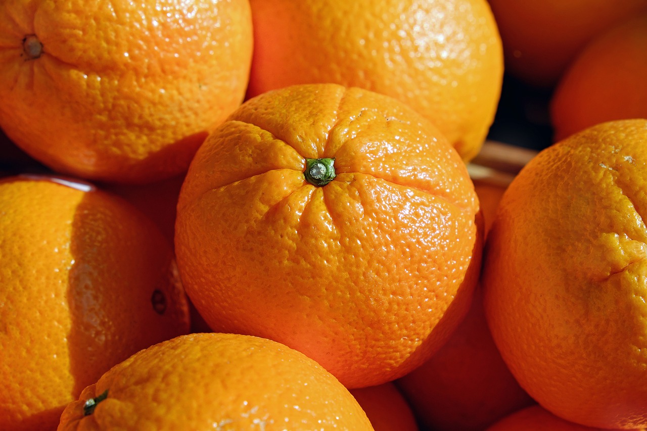 a pile of oranges sitting on top of each other, a picture, detailed zoom photo, close up photo