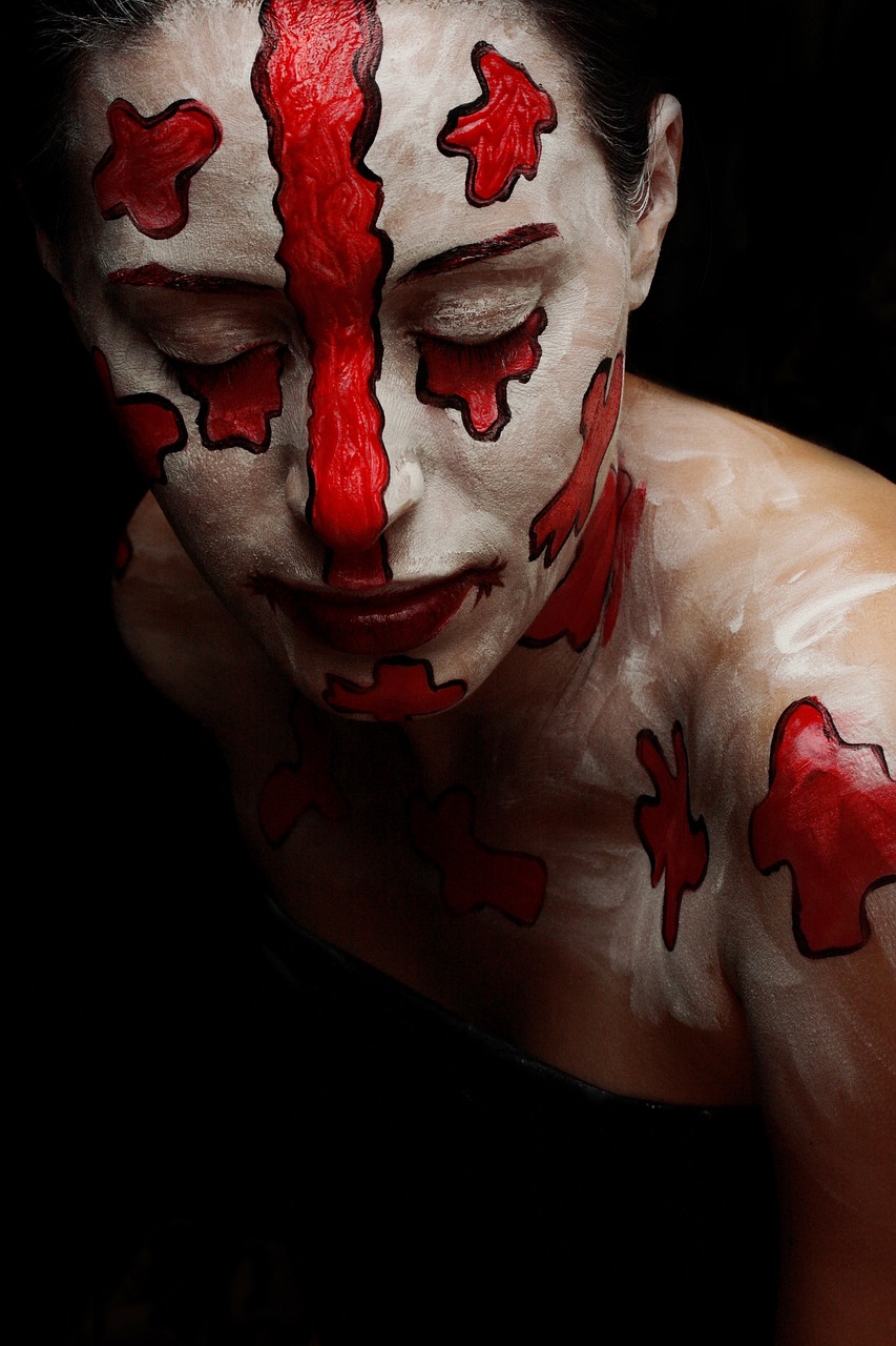 a woman with white and red paint on her face, inspired by Taro Yamamoto, reddit, process art, red cross, porcelain skin ”, kratos, top-down shot