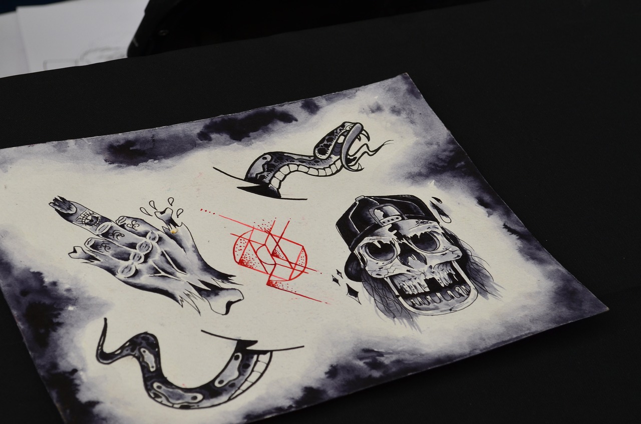 a piece of art sitting on top of a table, an ink drawing, by Adam Szentpétery, behance, tattoo sketches, on a gray background, horror elements, gouache