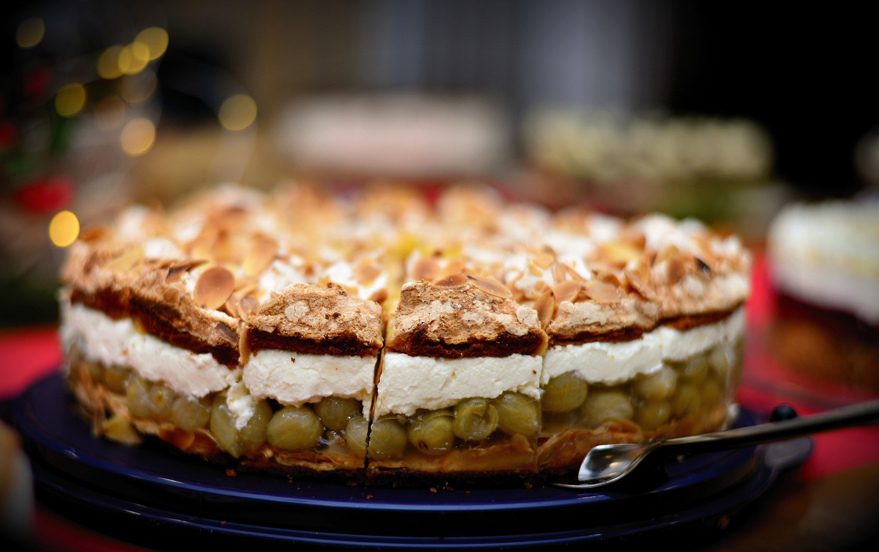 a cake sitting on top of a blue plate, by Etienne Delessert, pexels, arabesque, pie eyes, close up shot from the side, multilayer, in 2 0 1 2