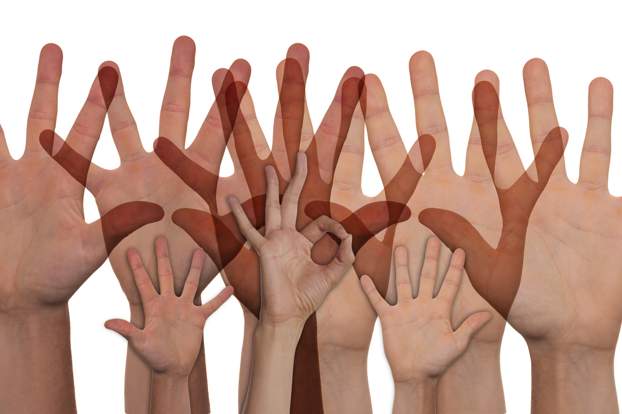 a group of people making a heart with their hands, a digital rendering, figuration libre, on black background, reddish, rubbing hands!!!, skin tones