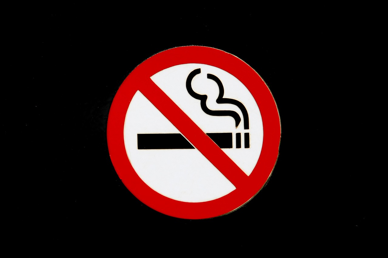 a no smoking sign on a black background, a picture, 2000s photo, 8 0 mm photo, very accurate photo, portlet photo