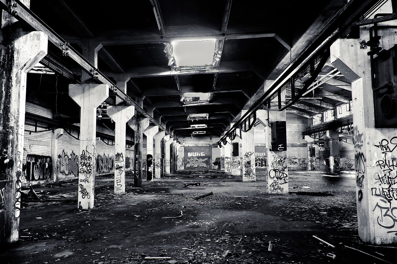 a black and white photo of an abandoned building, graffiti, factory floor, chicago, full length photo, michael wellen