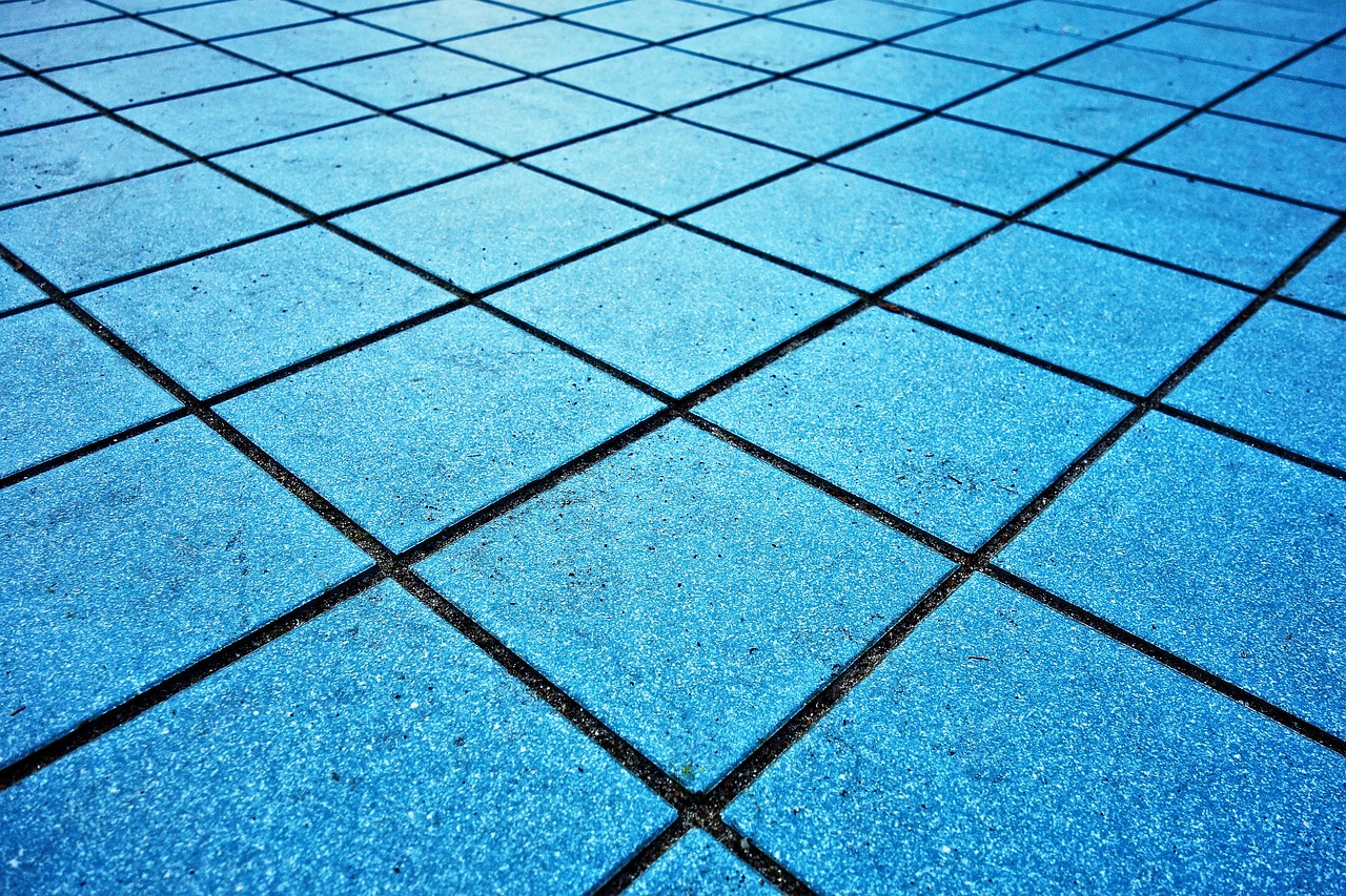 a close up of a blue tiled floor, by Thomas Häfner, shutterstock, outdoor photo, low angle dimetric composition, chalk, stock photo