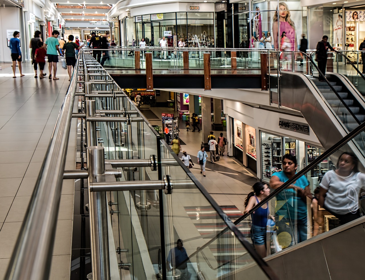 a group of people walking down an escalator, a photo, lots of shops, usa-sep 20, inside the building, australian