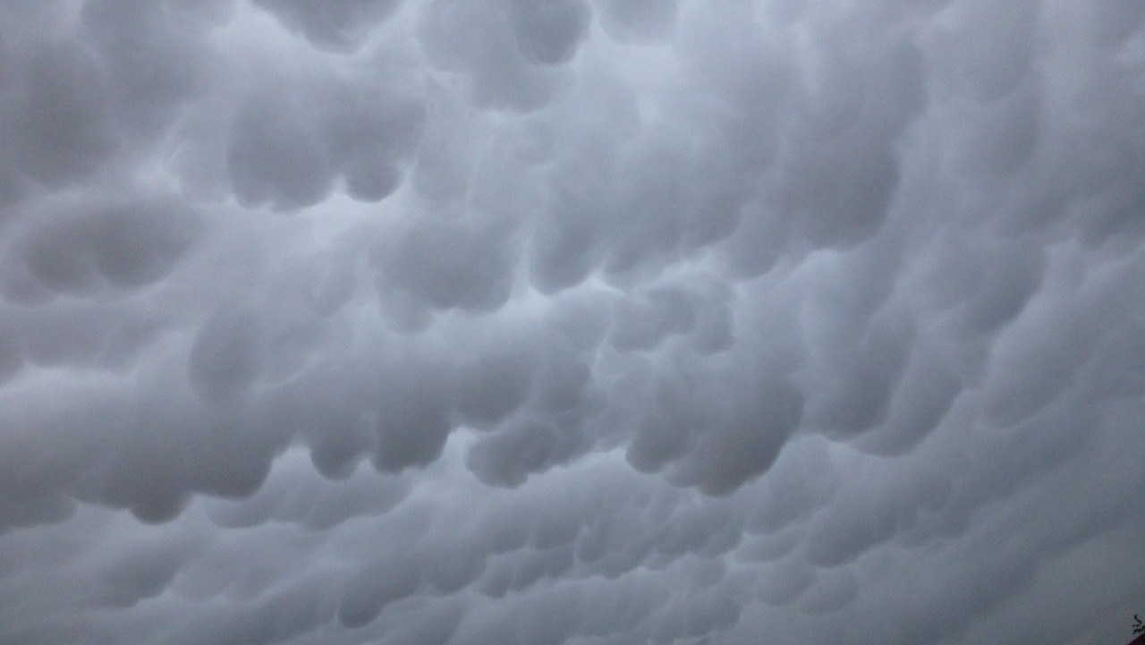 a group of people standing on top of a beach under a cloudy sky, by Jan Konůpek, precisionism, mammatus clouds, [ closeup ]!!, complex ceiling, mid closeup