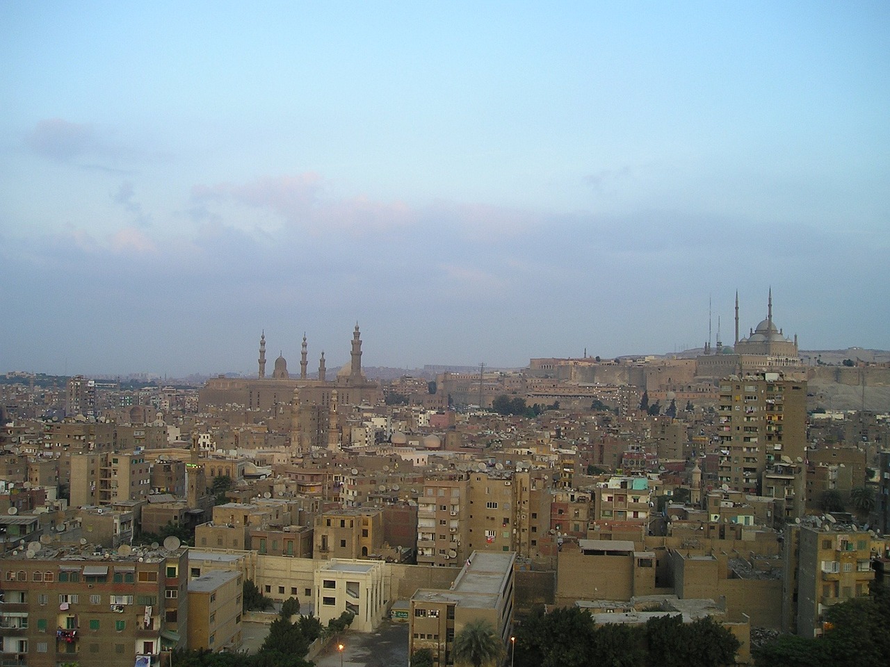 a view of a city from the top of a hill, a picture, by Ahmed Yacoubi, flickr, hurufiyya, accurate to egyptian tradition, spires, early evening, pitt