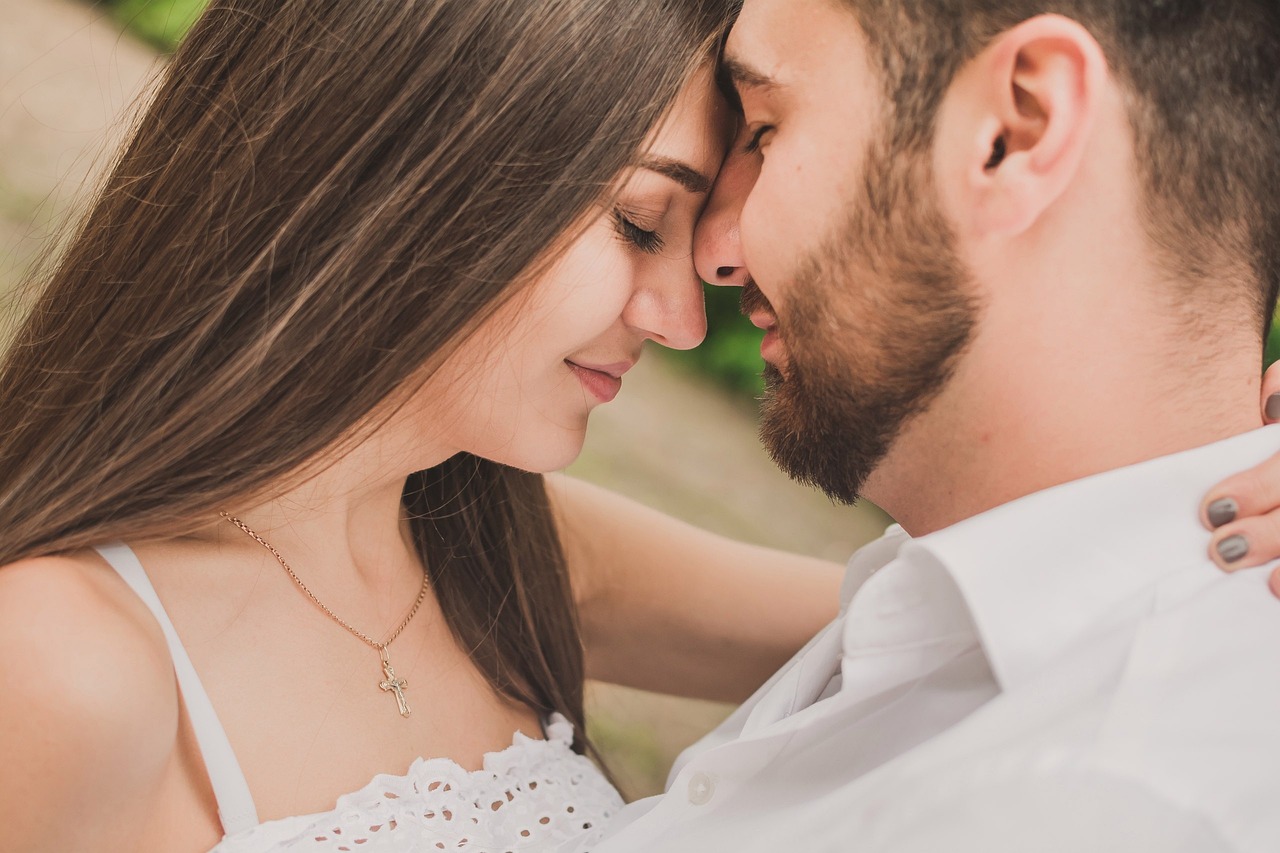 a man and a woman are looking at each other, by Hristofor Žefarović, shutterstock, romanticism, closeup of an adorable, loving embrace, portrait shot 8 k, wearing white clothes