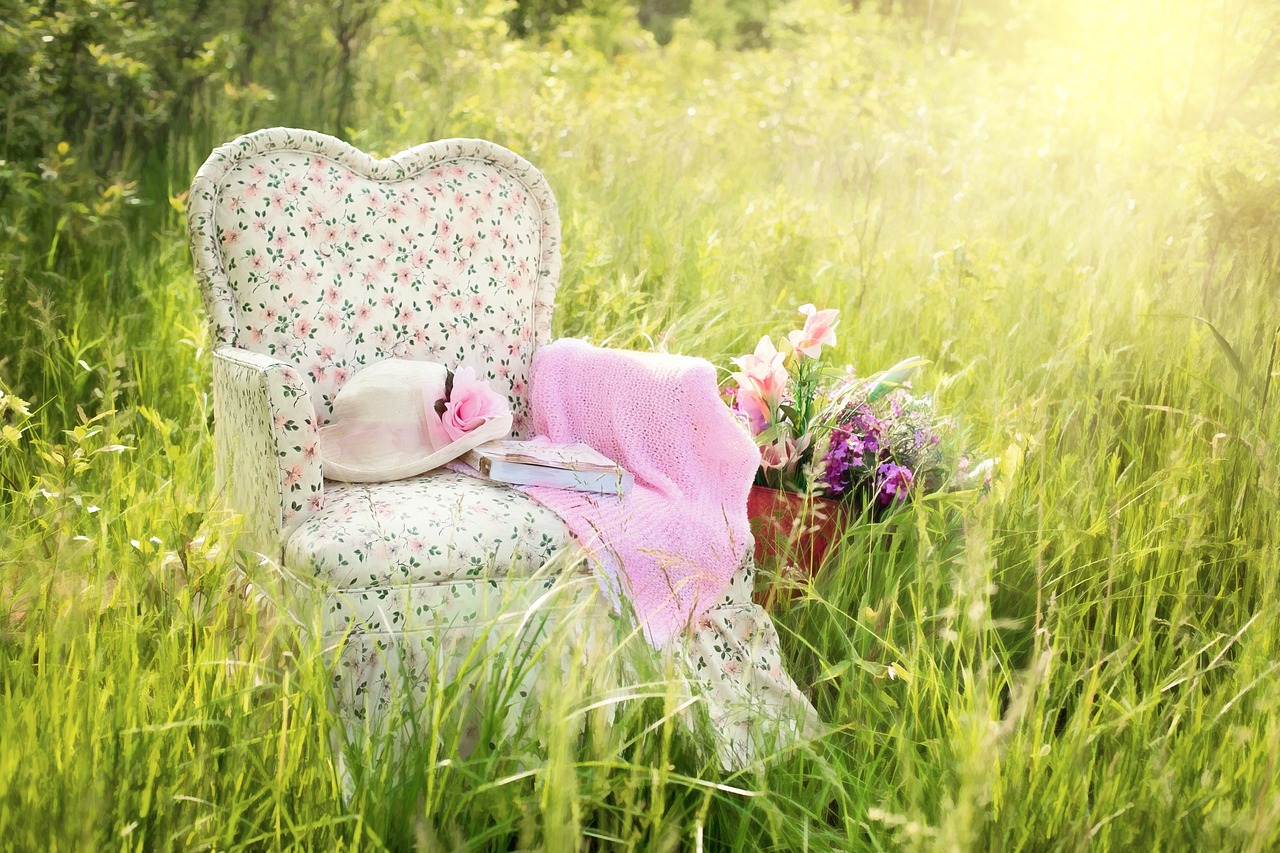 a teddy bear sitting on top of a chair in a field, a picture, pixabay contest winner, romanticism, pink white and green, reading nook, hiding in grass, comfy chairs