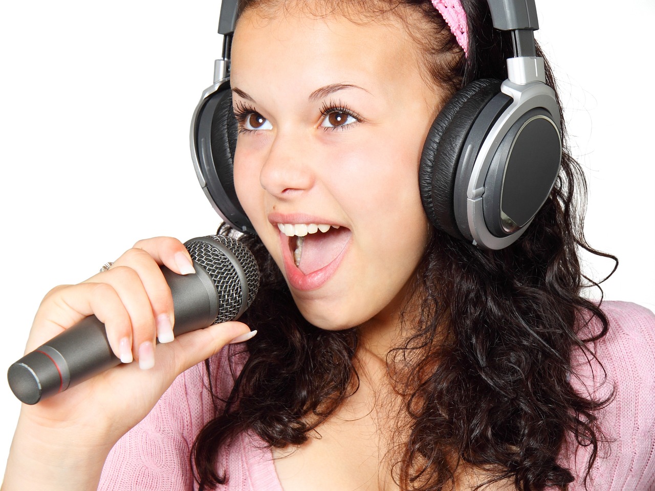 a woman singing into a microphone with headphones on, by John Luke, shutterstock, teenagers, istockphoto, studio quality product, on white background