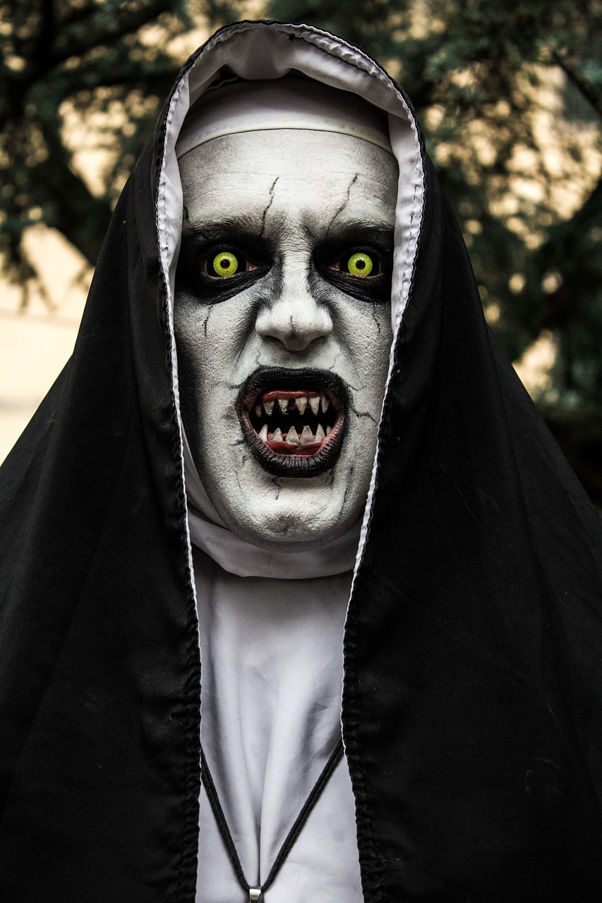 a close up of a person wearing a nun costume, by Luis Molinari, shutterstock, lowbrow, horror animatronic, nightmare in the park, with mouth open, demonic monster