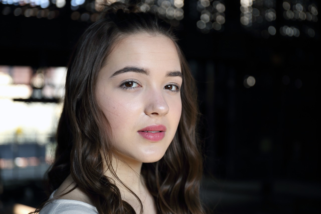a close up of a woman with long hair, a portrait, shutterstock, photorealism, portrait sophie mudd, acting headshot, aged 13, perfect crisp sunlight