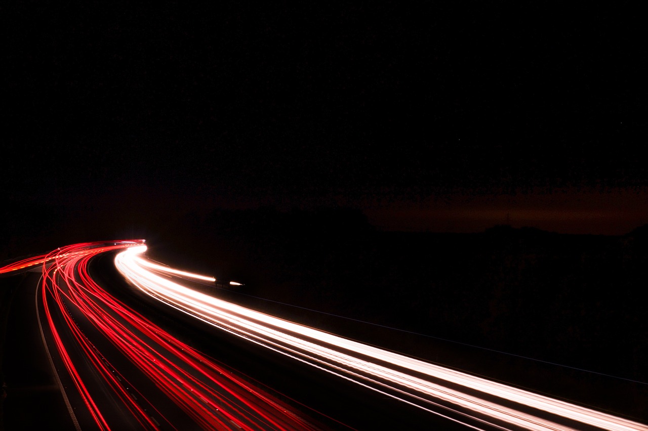 a long exposure photograph of a highway at night, screen capture, background ( dark _ smokiness ), car lights, abstract lighting