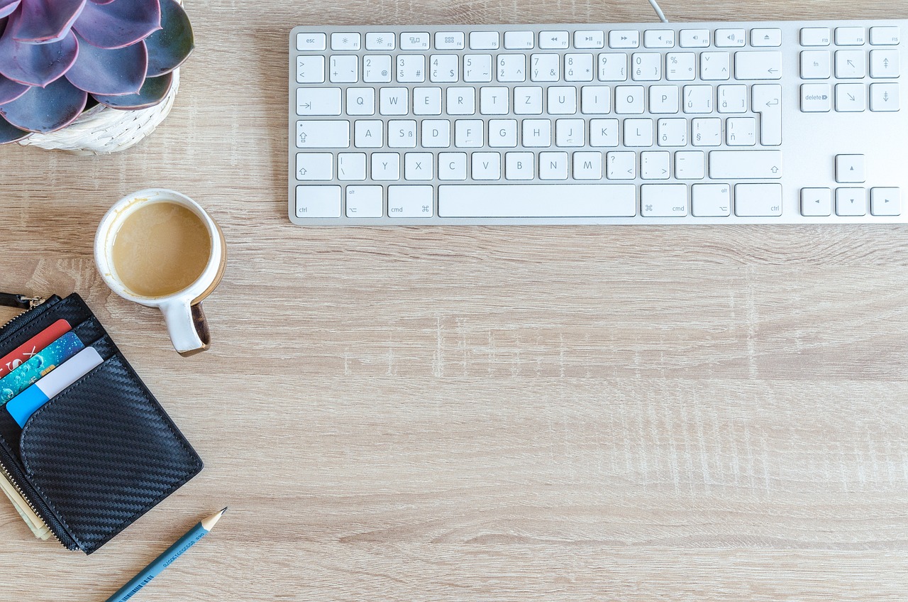 a computer keyboard sitting on top of a wooden desk next to a cup of coffee, pexels, background image, thumbnail, full body image, abcdefghijklmnopqrstuvwxyz