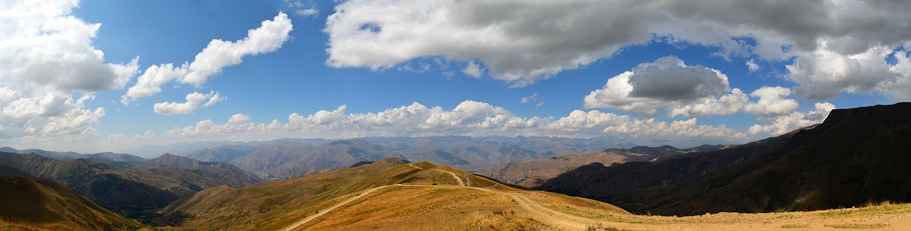 a view of the mountains from the top of a hill, by Muggur, flickr, les nabis, panorama view of the sky, october, torri, georgic