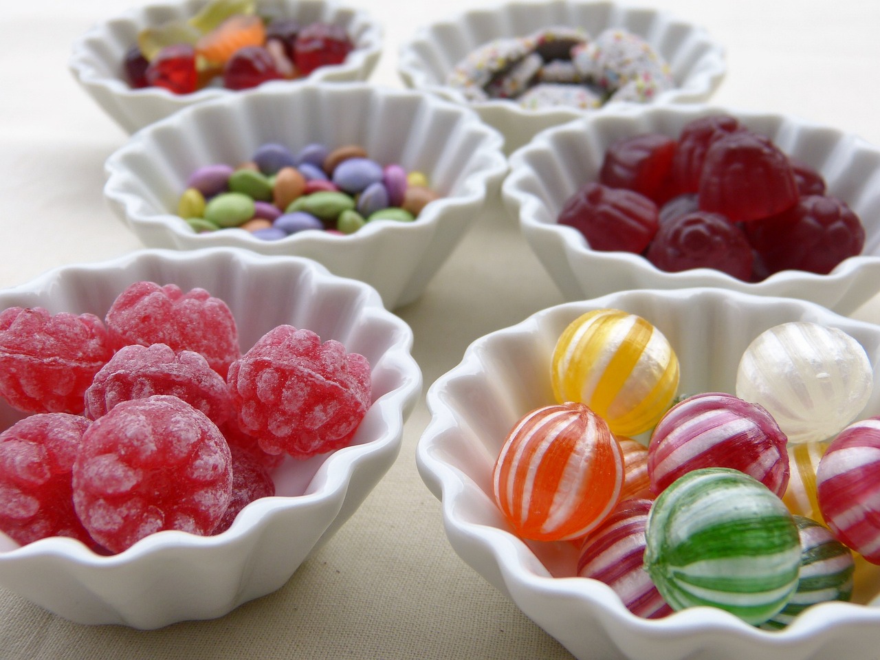 a white bowl filled with assorted candies, by Susan Heidi, flickr, plates of fruit, sugary sweet, jellybeans, vintage inspired