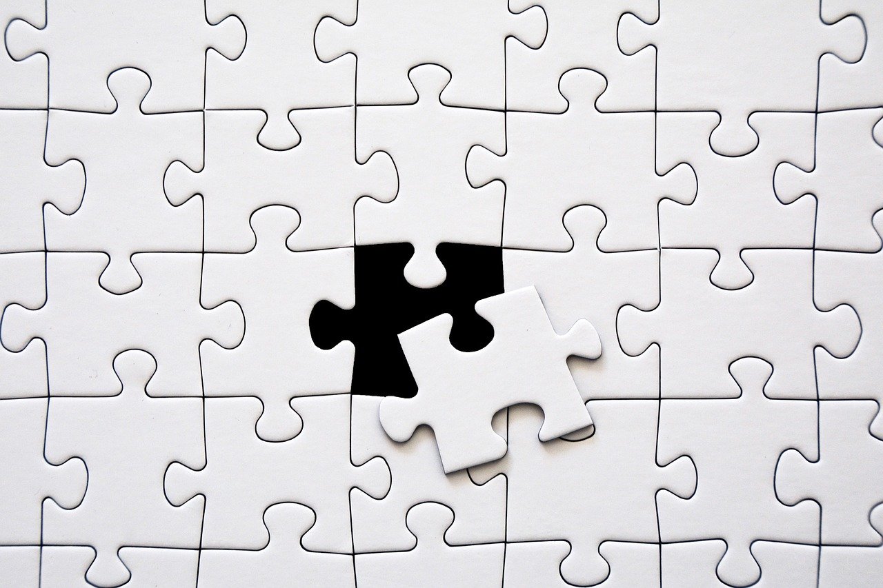 a close up of a puzzle piece on a table, a jigsaw puzzle, by Alexander Robertson, minimalism, istockphoto, black on white only, cut-away, porcelain