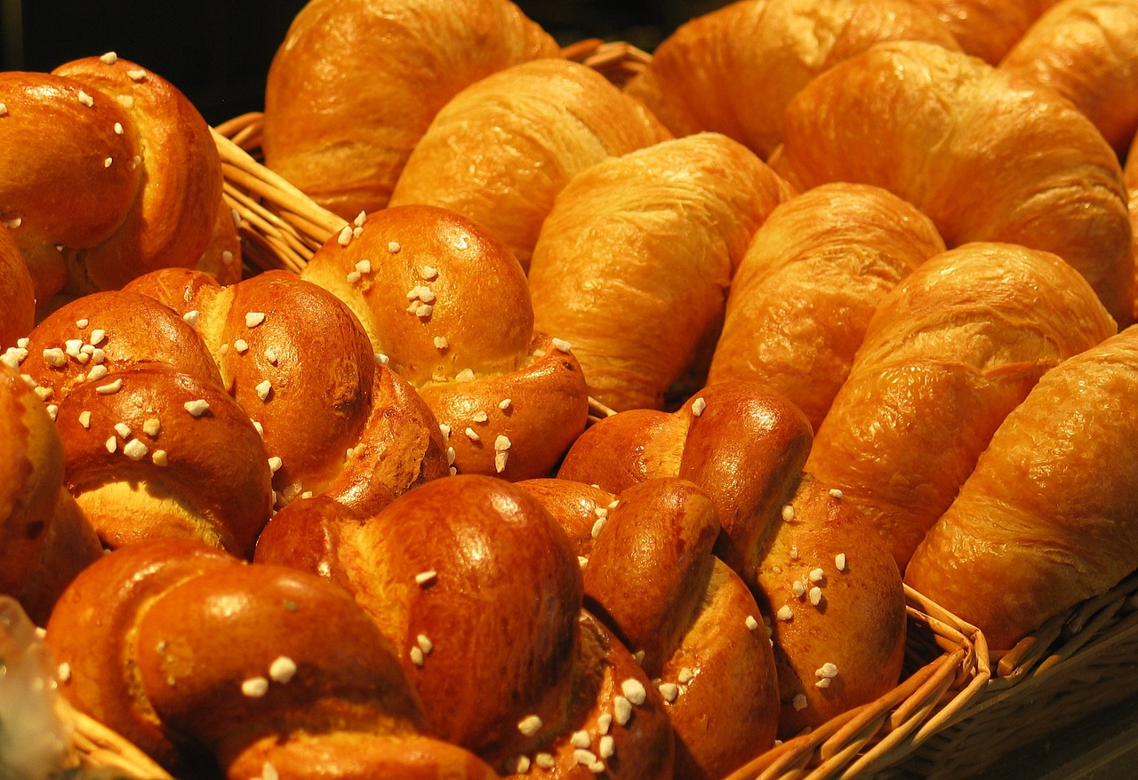 a basket filled with lots of different types of bread, pexels, art nouveau, band of gold round his breasts, beijing, award - winning crisp details ”, smooth curvatures