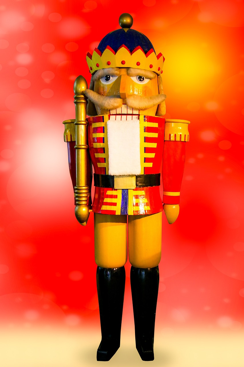 a close up of a toy soldier on a red background, a raytraced image, by Edward Corbett, folk art, a wooden, king in yellow, dazzling lights, museum quality photo