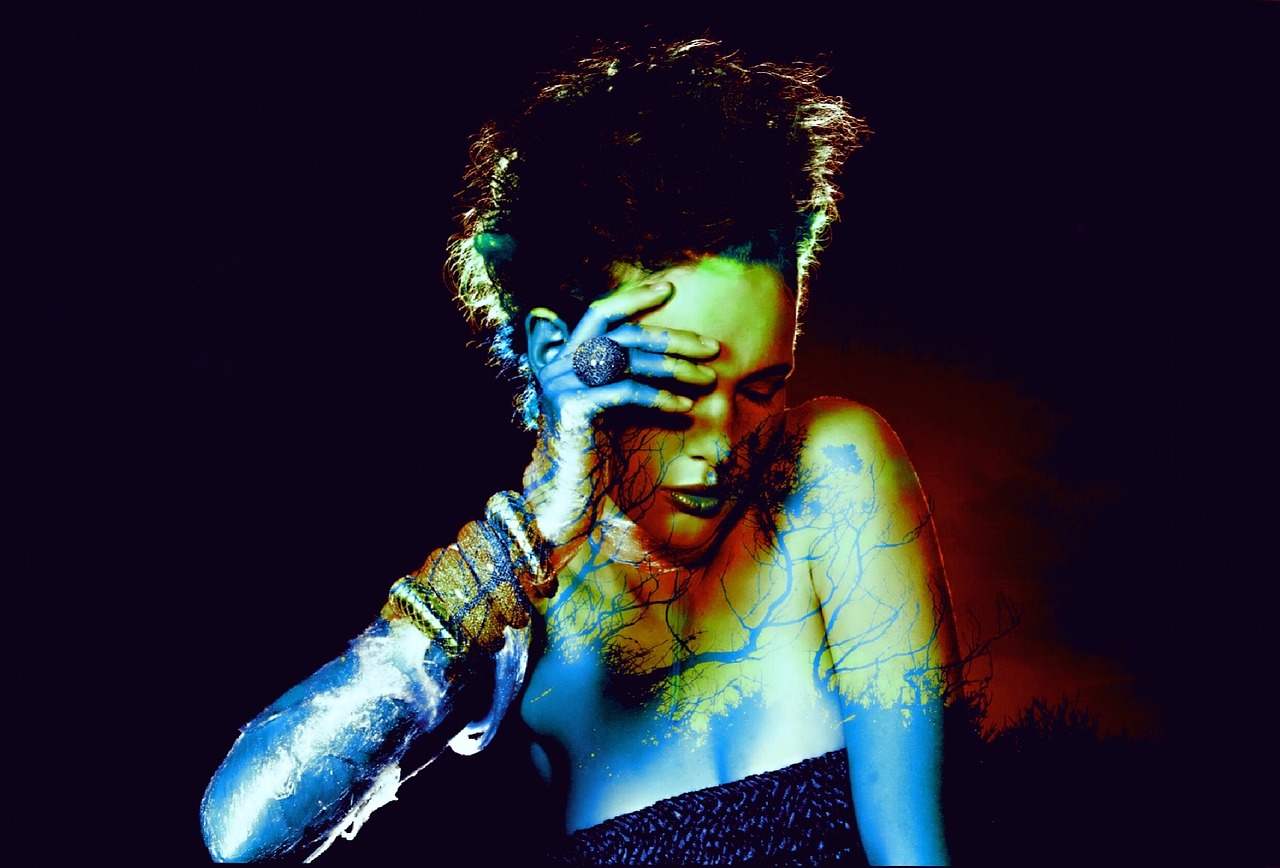 a close up of a person on a cell phone, digital art, inspired by Bert Stern, art photography, dark neon punk, kristen stewart, god. dramatic gold blue lighting, lascivious pose