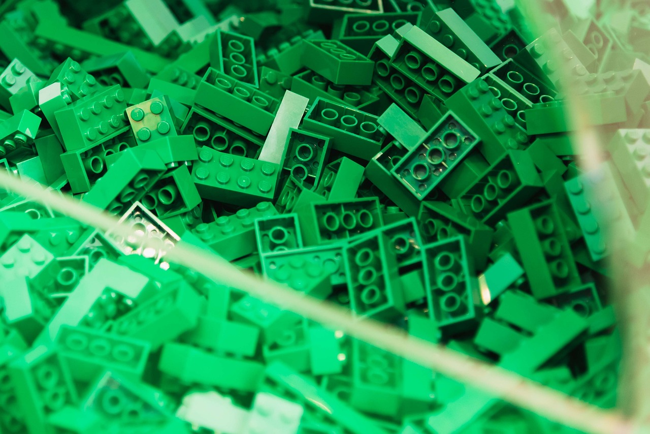 a pile of green legos sitting on top of a table, plasticien, detail shots, high detailed photo, product introduction photo