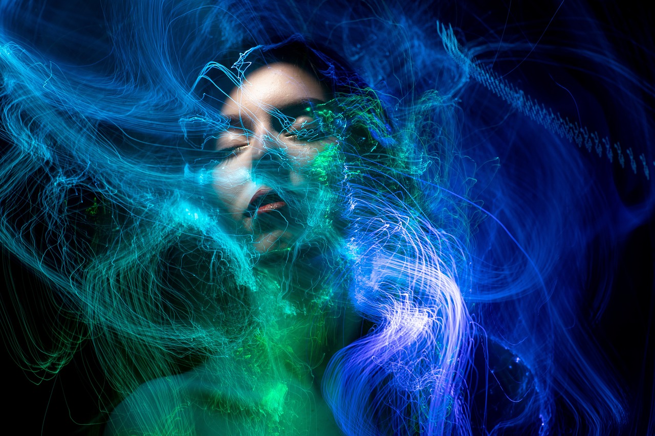 a close up of a person with long hair, digital art, by Eugeniusz Zak, shutterstock, diffuse lightpainting, blue lighting. fantasy, portrait of teenage medusa, wisps of energy in the air