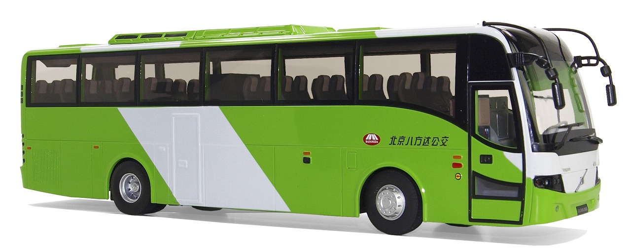 a green and white bus on a white surface, inspired by Masamitsu Ōta, pixabay, dau-al-set, full lenght view. white plastic, guangjian huang, 1505, handheld
